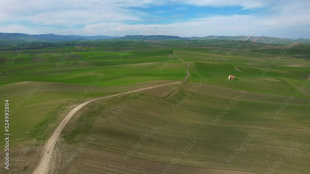 Green landscape with stunning fields filmed in the beautiful province of Basilicata in Southern Italy. These are the typical and famous Italian hills. A bit dryer than usual because of climate change. Green landscape with stunning fields filmed in the beautiful province of Basilicata in Southern Italy. These are the typical and famous Italian hills. A bit dryer than usual because of climate change.