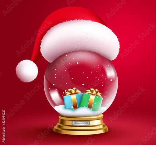 Christmas crystal ball vector design. 3d realistic snow ball with santa hat and gift boxes elements in red background for xmas ornament decoration design. Vector illustration.
