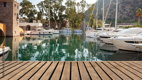 Empty wooden platform on yachts and motor boat in marina port, Aspat Marina. Front view