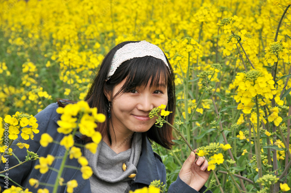 a happy girl in rapeseed field a happy girl in rapeseed field
