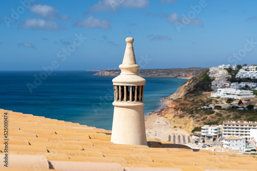 Algarve chimney. Traditional house chimney and roof from the Algarve. Salema beach, south of Portugal photo