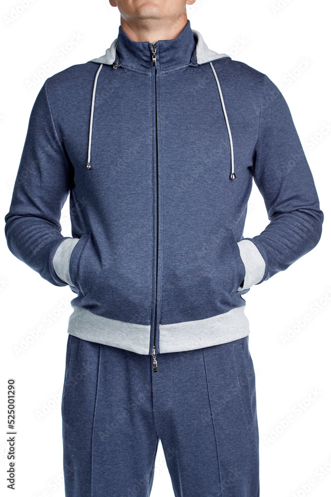 Male model of athletic build in a blue cotton hoodie, standing out isolated a white background. Front view. Male model of athletic build in a blue cotton hoodie, standing out isolated a white background. Front view.