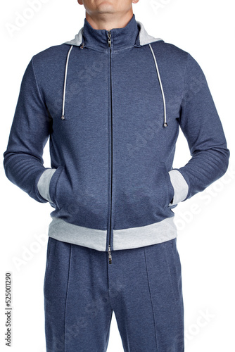 Male model of athletic build in a blue cotton hoodie, standing out isolated a white background. Front view.