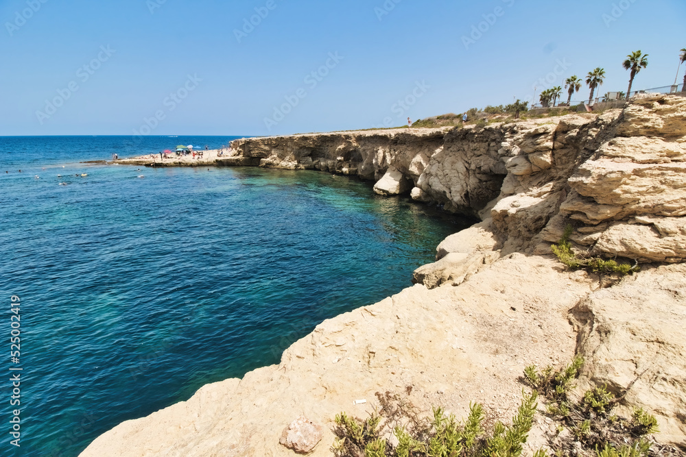 An rocky cliff inlet on the coast of Bugibba, St. Paul's Bay in Malta