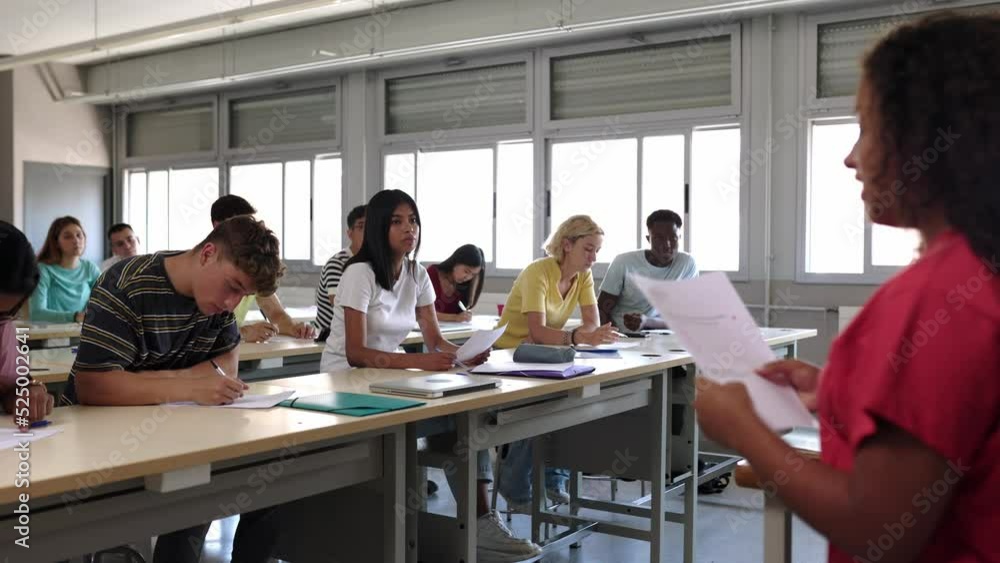 Young african american teenage girl student presenting a school project to classmates and teacher in classroom High quality 4k footage Young african american teenage girl student presenting a school project to classmates and teacher in classroom High quality 4k footage