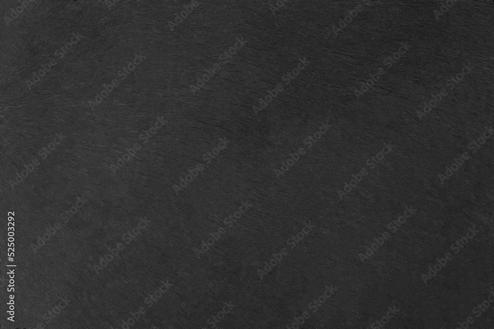 Black slate stone texture serving board surface background 