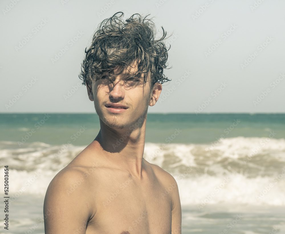 A handsome young man on the seashore. Portrait of a handsome young man. A handsome young man on the seashore. Portrait of a handsome young man.