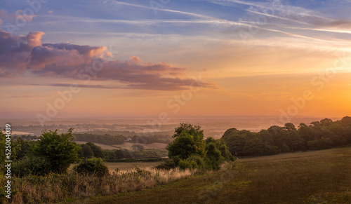 Dramatic August dawn sky from the North's Seat Hastings Country Park East Sussex in the south east of England UK photo