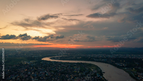 Aerial view of an Indian city with river during twilight