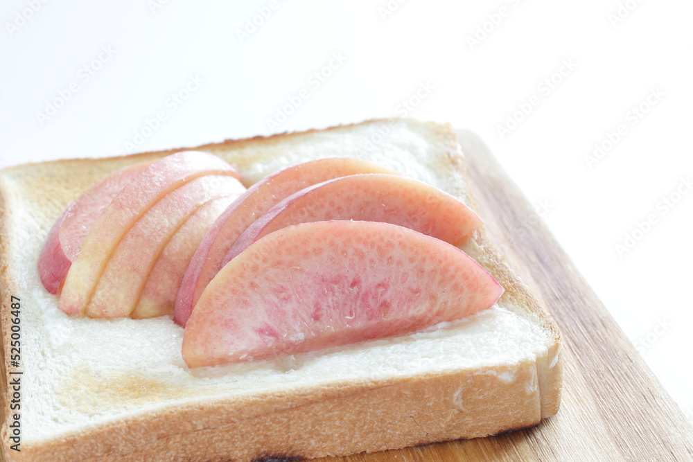 Japanese peach on toast with copy space for summer gourmet cooking Japanese peach on toast with copy space for summer gourmet cooking