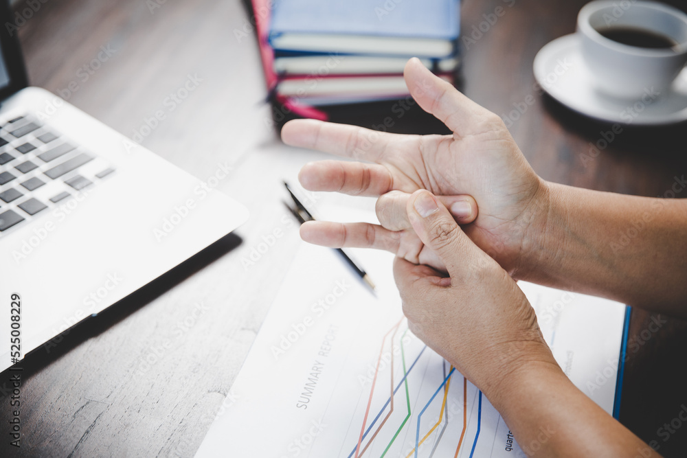 Arthritis person, finger woman ache from working in office. Concept office syndrome hand pain
