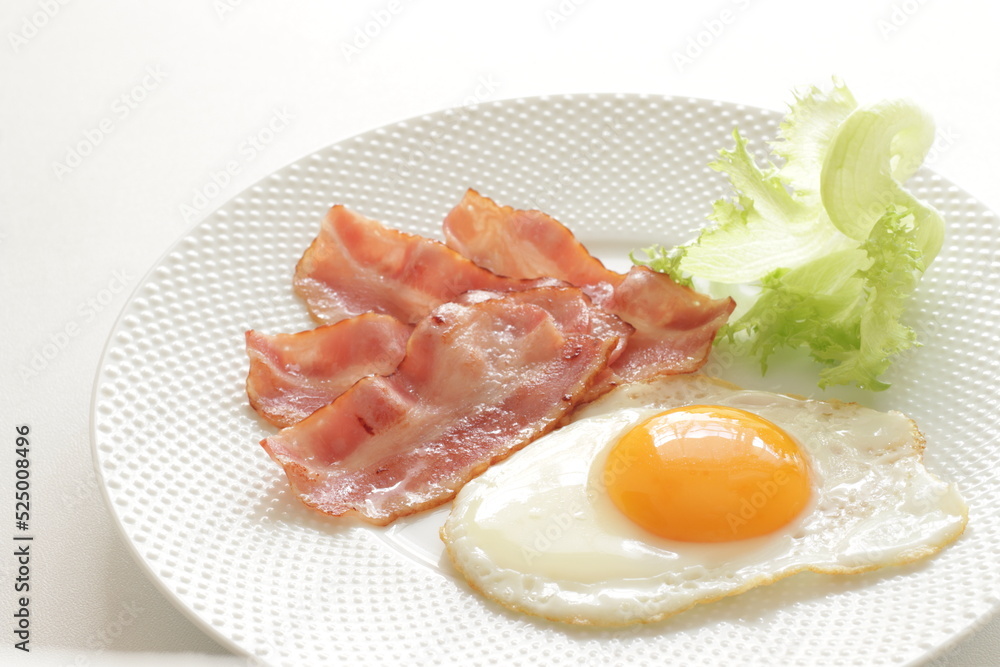 pan fried bacon and sunny side up fried egg for breakfast menu pan fried bacon and sunny side up fried egg for breakfast menu