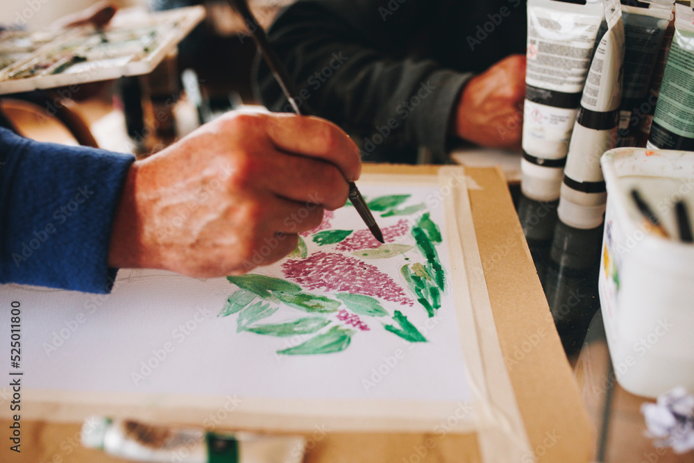 Hands of man painting at home Hands of man painting at home