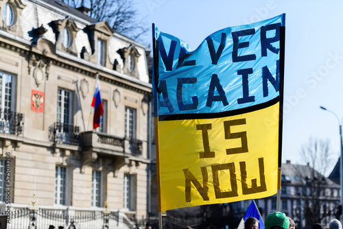 Never again is now placard as hundreds of demonstrators gathered in front of Russian Consulate in solidarity with Ukrainians and against the war