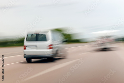 Rear view of unrecognizable blur view of white wagon van driving on highway autobahn © ifeelstock