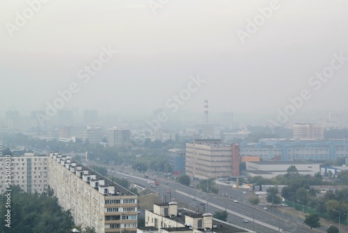 Moscow district under smog smoke from forest fires in Ryazan, Russia. Wildfire natural disaster ecological situation. Global warming, climate change. Environment conversation