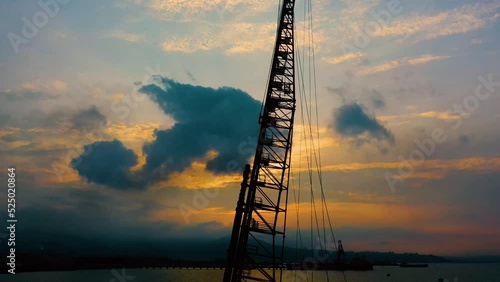 sunset pile driving - 2 photo