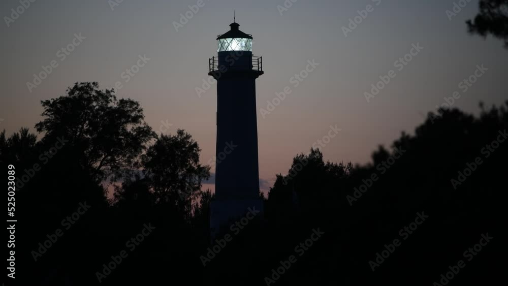 Light beam shines out into misty sky from Lighthouse at sunset on Possidi cape beach, Kassandra peninsula, Halkidiki, Greece. Light beam shines out into misty sky from Lighthouse at sunset on Possidi cape beach, Kassandra peninsula, Halkidiki, Greece.