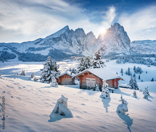 Untouched winter landscape. Frosty morning view of Alpe di Siusi village. Attractive winter landscape of Dolomite Alps. Exciting outdoor scene of ski resort, Ityaly. photo