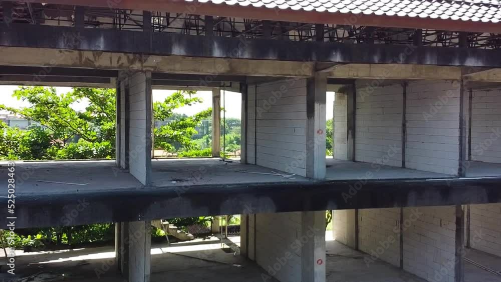 Drone travels through a hotel room to reveal an abandoned and overrun hotel on a Balinese beach Drone travels through a hotel room to reveal an abandoned and overrun hotel on a Balinese beach