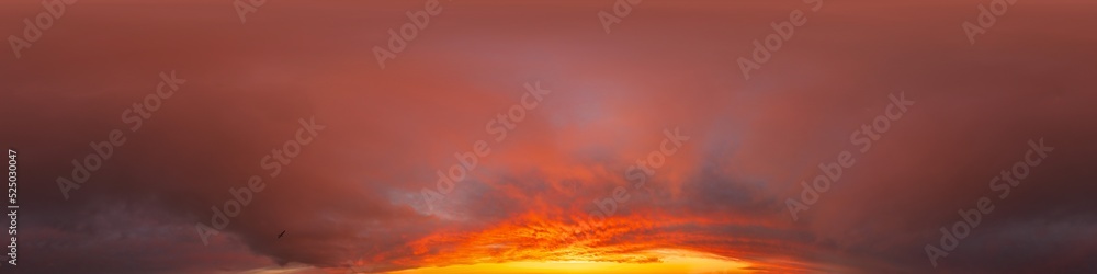 Obraz premium Burning red dramatic overcast dark sunset sky panorama. Hdr seamless spherical equirectangular 360 panorama. Sky dome or zenith for 3D visualization and sky replacement for aerial drone 360 panoramas.