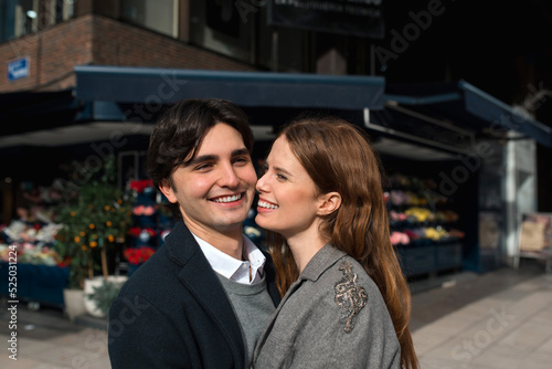 Loving couple enjoying time together on street