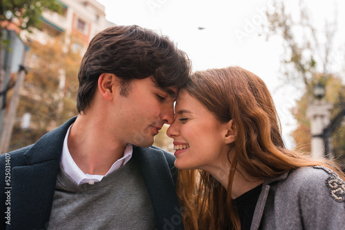 Young couple in love embracing on the street