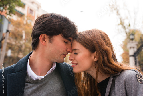 Young couple in love embracing on the street