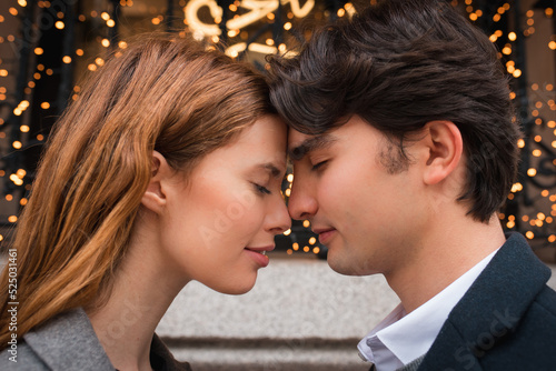 Young couple in love enjoying romantic moment on street