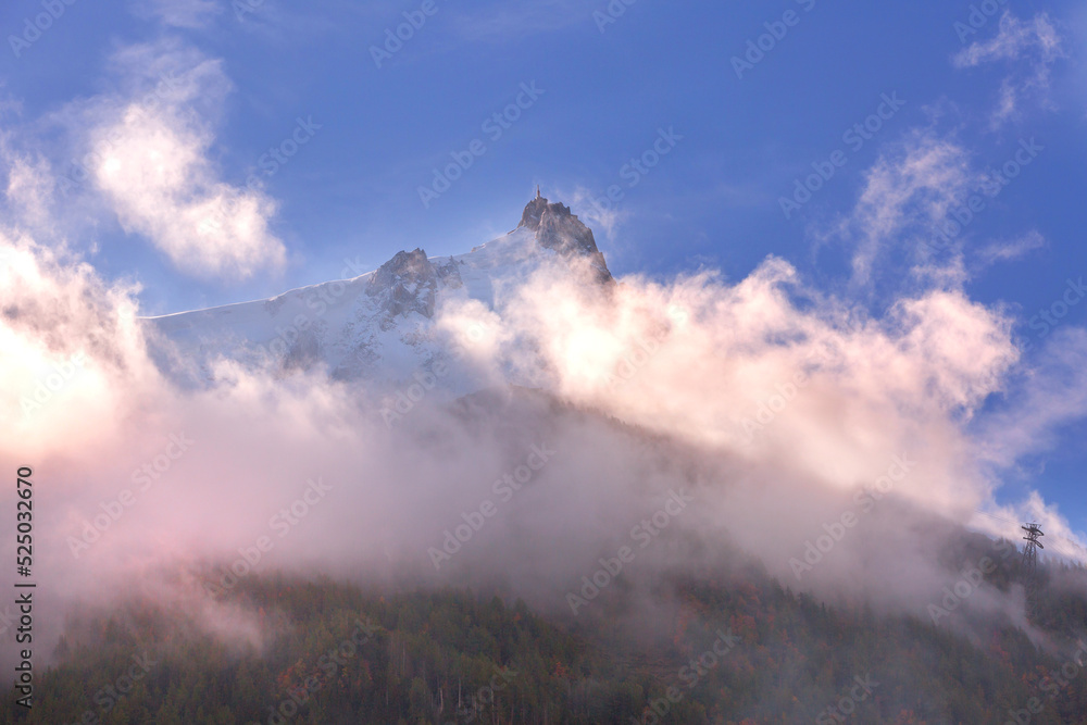 Colorful evening mountains landscape with clouds