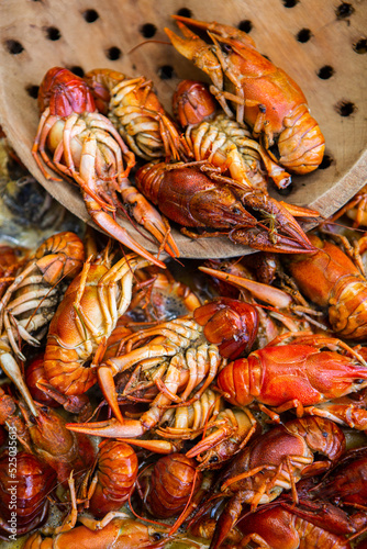 Boiled red crayfish or crawfish with herbs. Crayfish boiling in the pot on the fire