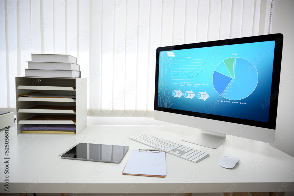 A modern scientist office desk with desktop computer with science analysis workflow on the screen A modern scientist office desk with desktop computer with science analysis workflow on the screen