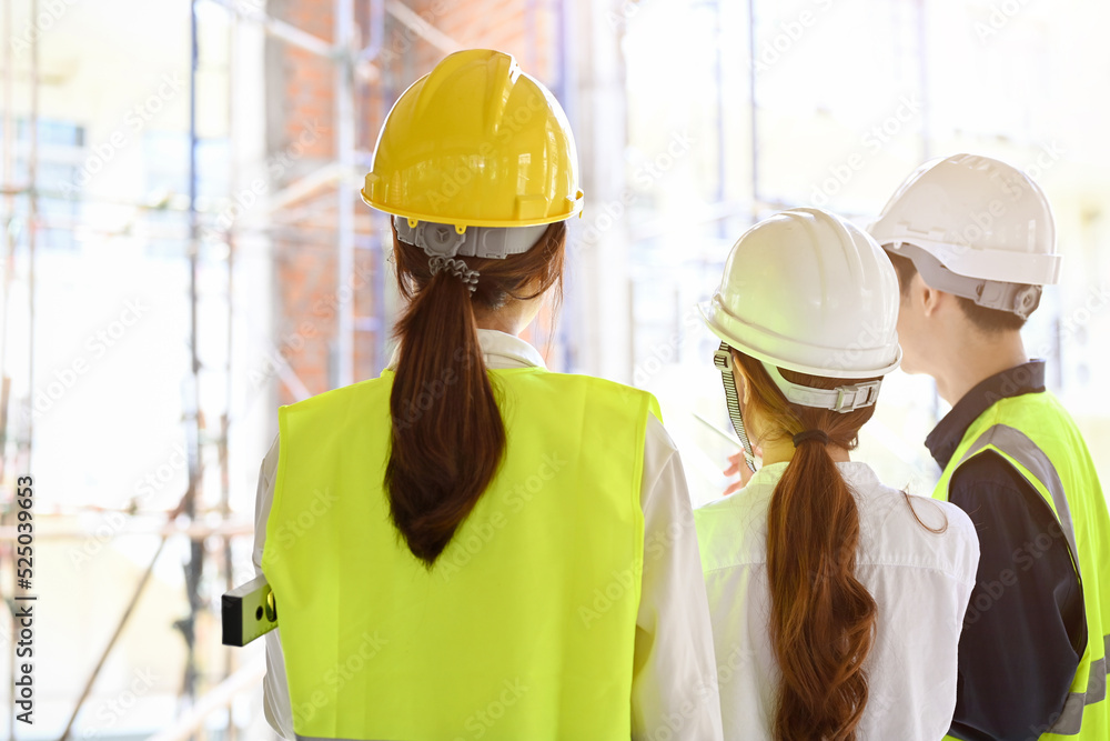 back view, A group of engineer, architect or construction inspector in the construction site. back view, A group of engineer, architect or construction inspector in the construction site.