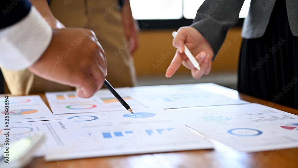 Close-up hands, A businessman meeting and discussing a financial plan with his group Close-up hands, A businessman meeting and discussing a financial plan with his group