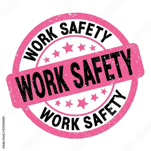 WORK SAFETY text written on pink-black round stamp sign.