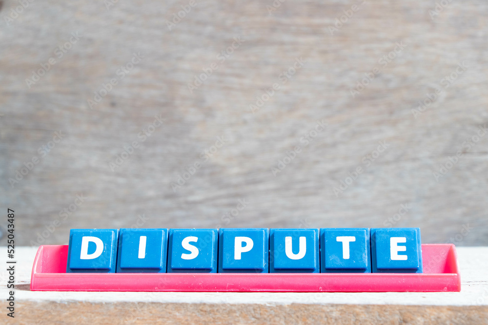 Obraz premium Tile alphabet letter with word dispute in red color rack on wood background