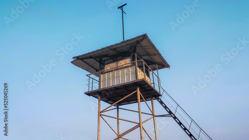 Guard post or guard tower use for border surveillance made of steel look rustic with blue sky. photo