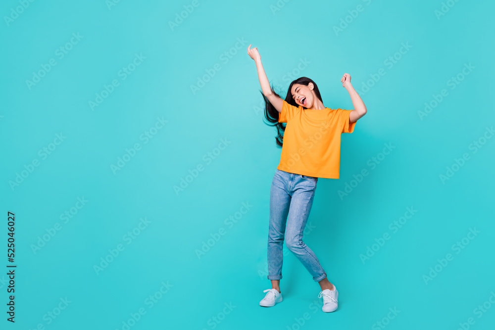 Full body photo of nice brunette lady dance wear t-shirt jeans shoes isolated on teal color background Full body photo of nice brunette lady dance wear t-shirt jeans shoes isolated on teal color background