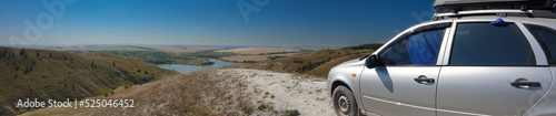 traveling by car, camping, view from high hills on a summer day