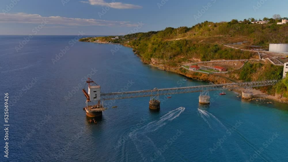 Birds eye view rotating left Drone Shot of a Sugar Cane Pier (Muelle de