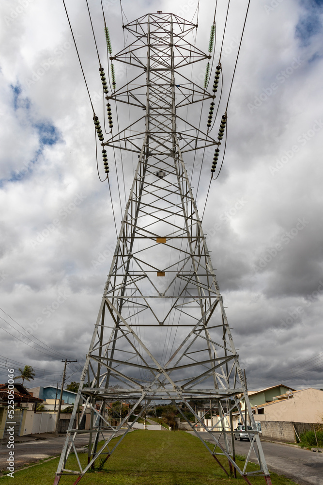 power transmission tower with clouds in the sky power transmission tower with clouds in the sky