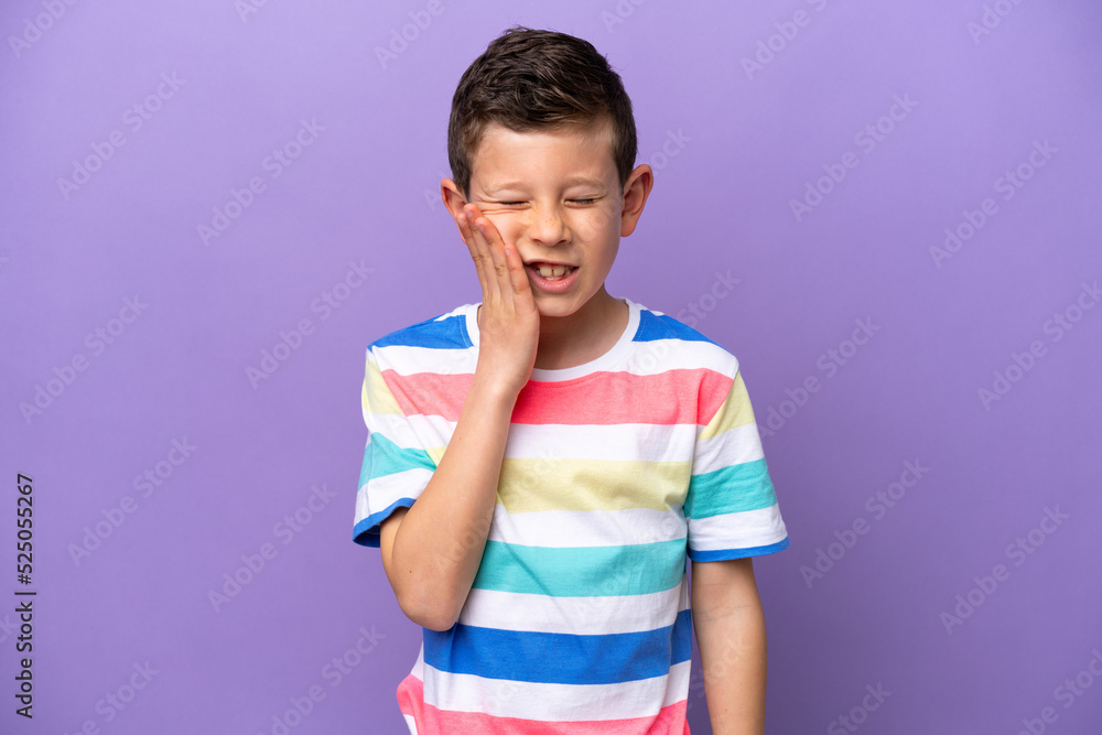 Little boy isolated on purple background with toothache Little boy isolated on purple background with toothache