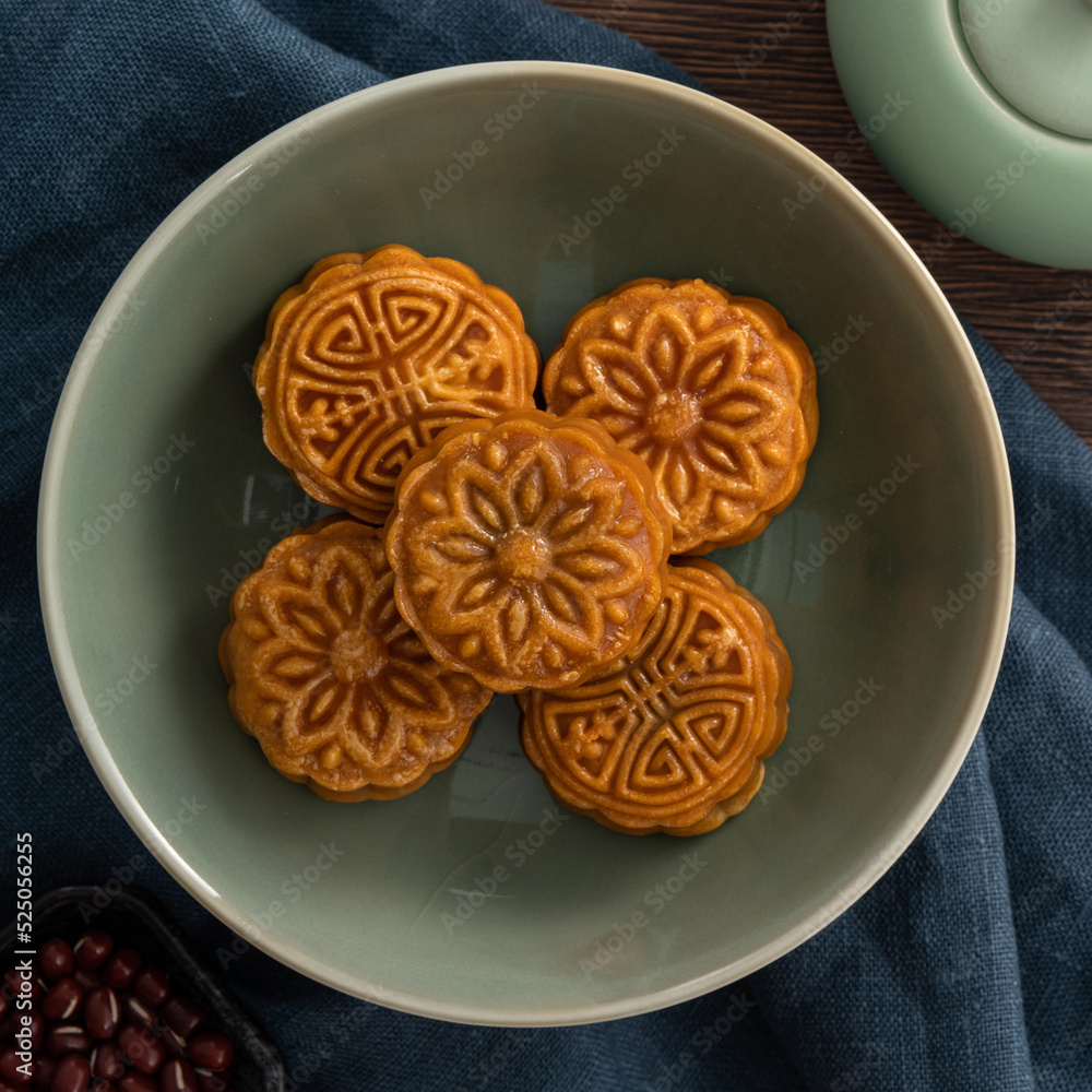 Delicious Cantonese moon cake for Mid-Autumn Festival food mooncake on wooden table background. Delicious Cantonese moon cake for Mid-Autumn Festival food mooncake on wooden table background.