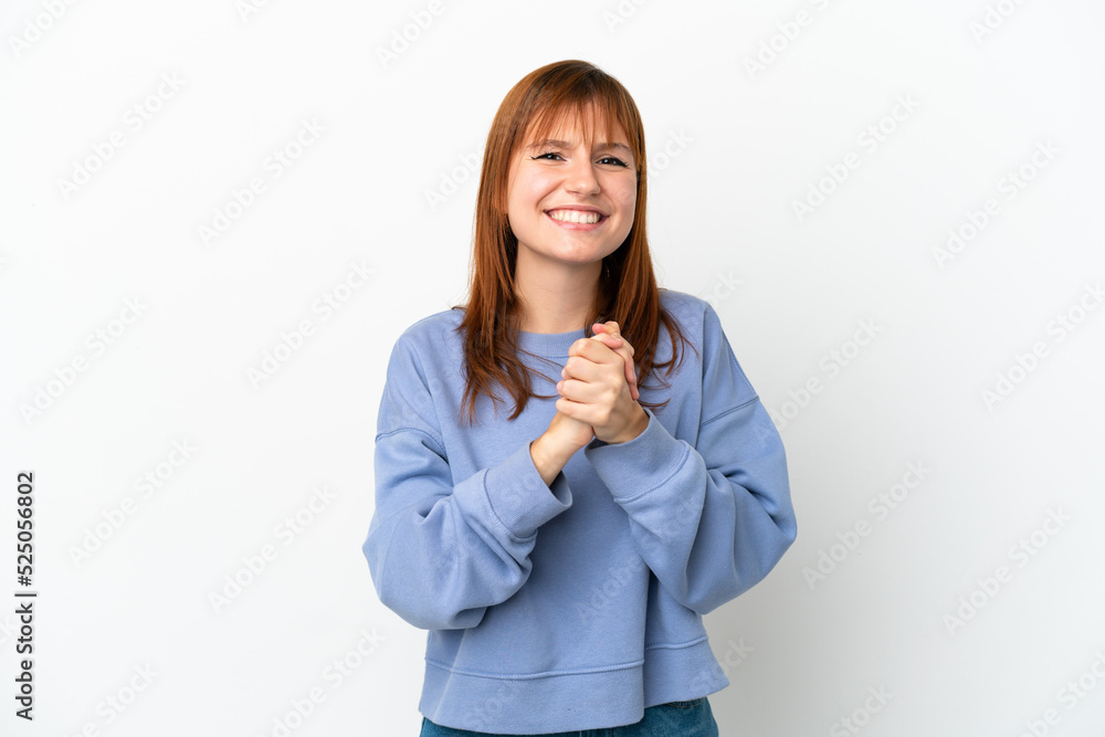 Redhead girl isolated on white background laughing Redhead girl isolated on white background laughing