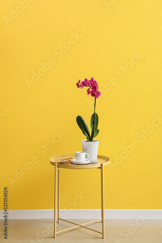 Orchid flower, cup of coffe...