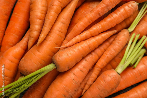 Fresh carrots as background, closeup