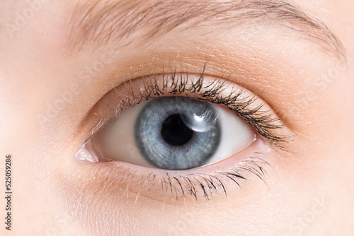 Canvas Print Young woman with blue eyes, closeup
