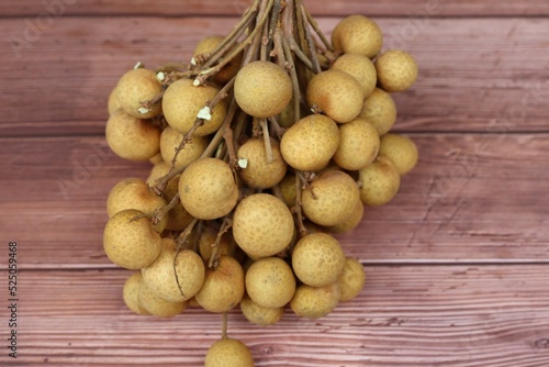 Fresh longan  popular fruit on wooden floor