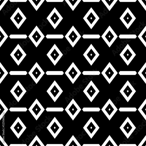 Repeated white polygons on black background. Ethnic wallpaper. Seamless surface pattern design with hexagons and rhombuses. Embroidery motif. Digital paper for page fills, web designing, textile print