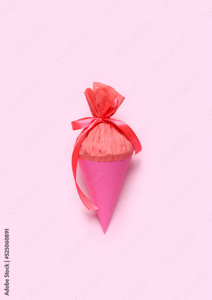 School cone on pink background